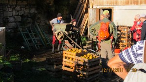 A friendly farmer making apple juice the traditional way..